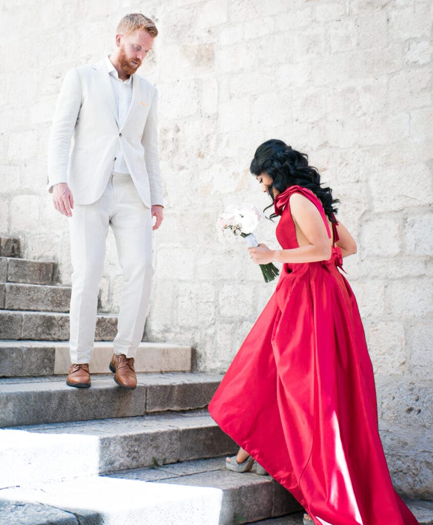 newlyweds on stairs by ruby photography