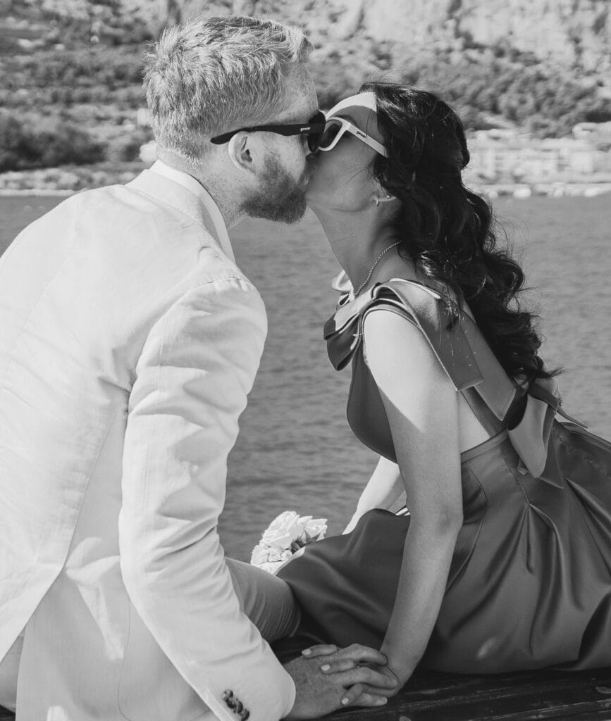 newlyweds kissing by ruby photography